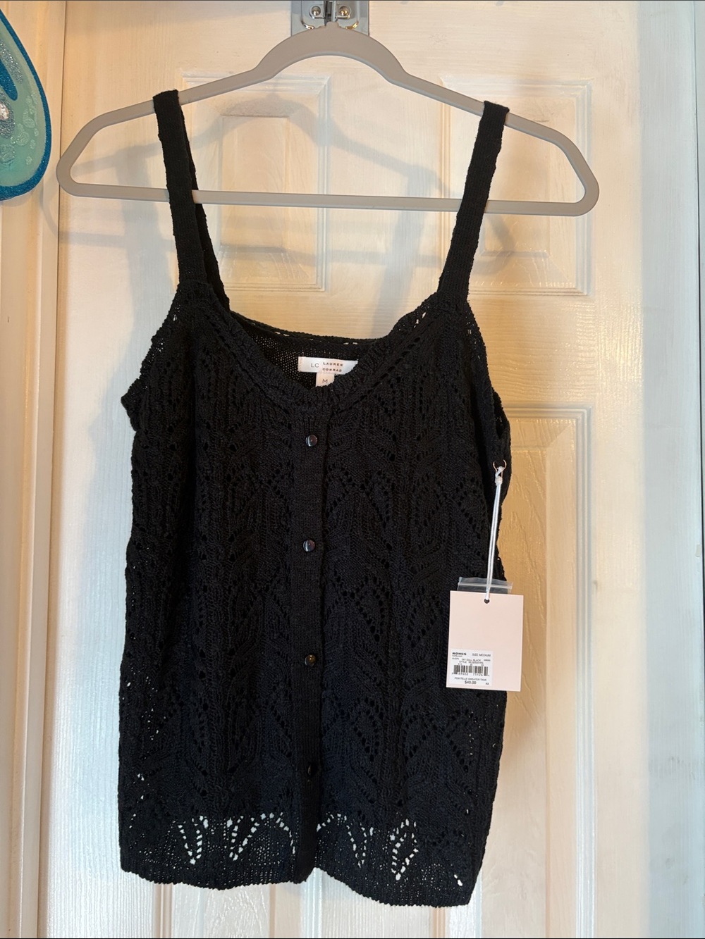 NWT Lauren Conrad  sweater tank size medium in color dull black.